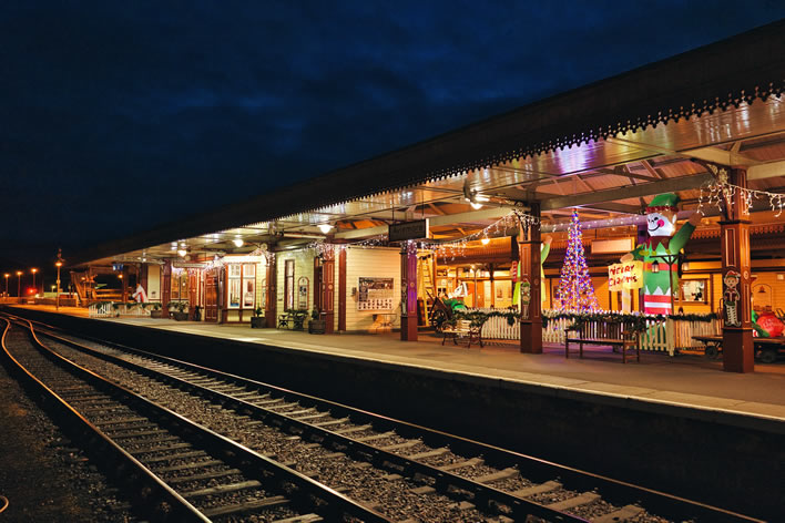Aviemore station with festive decorations in the evening